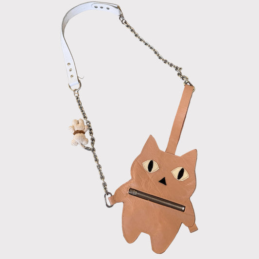 Metallic cat-shaped oversized-bag-charm-and pouch-with a chain on a gray background