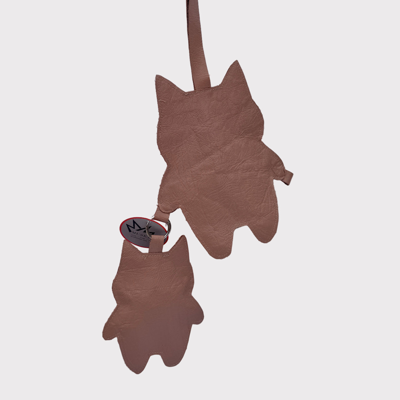 cat-shaped-oversized bag-charms on a light gray background