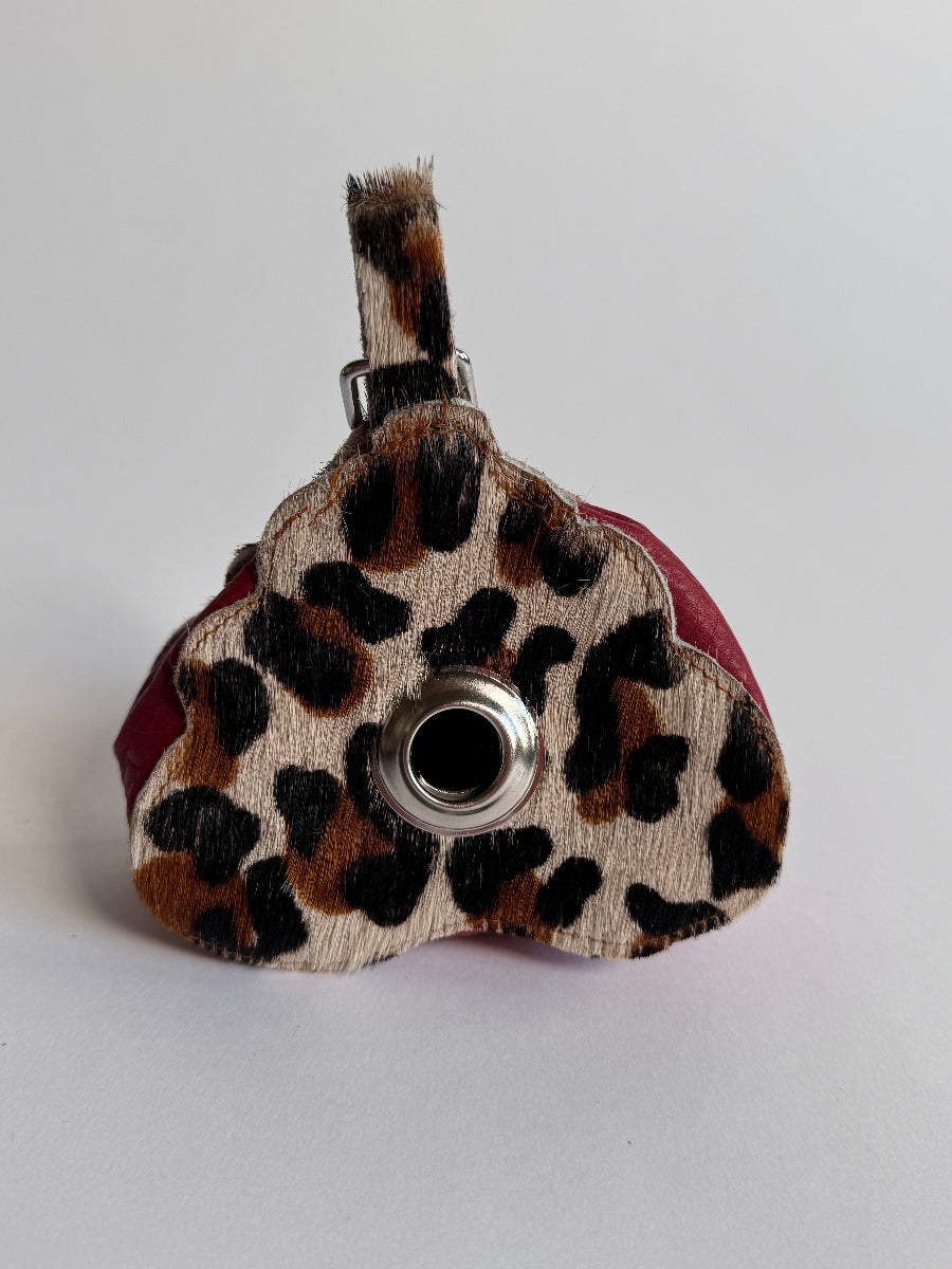 Le-Poop-Sac-Poop-bag-dispenser-from-Muse-Et-Moi with leopard print leather in poop emoji shape