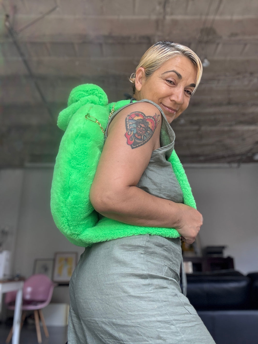 Muse et Moi Bark Bed Pro Backpack in neon green  with a dog sitting on