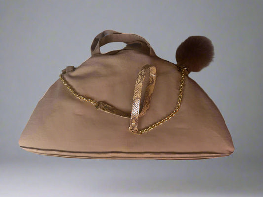 Muse et moi laptop lapdog bag in nude denim with leather and stainles steel shoulder strap and a pomp pomp