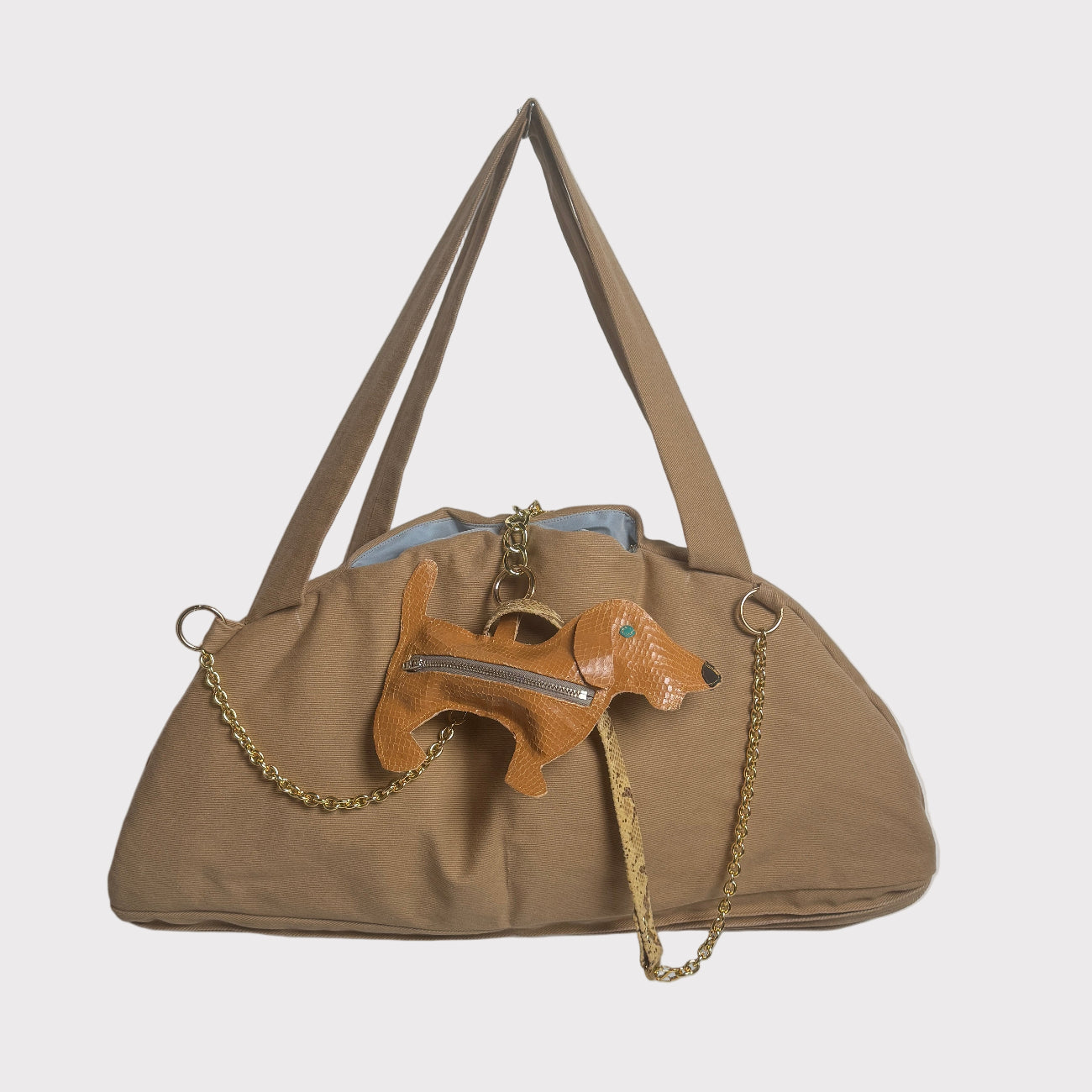 Beige bag with a little dog charm/ dog poop bag dispenser with cross body strap 