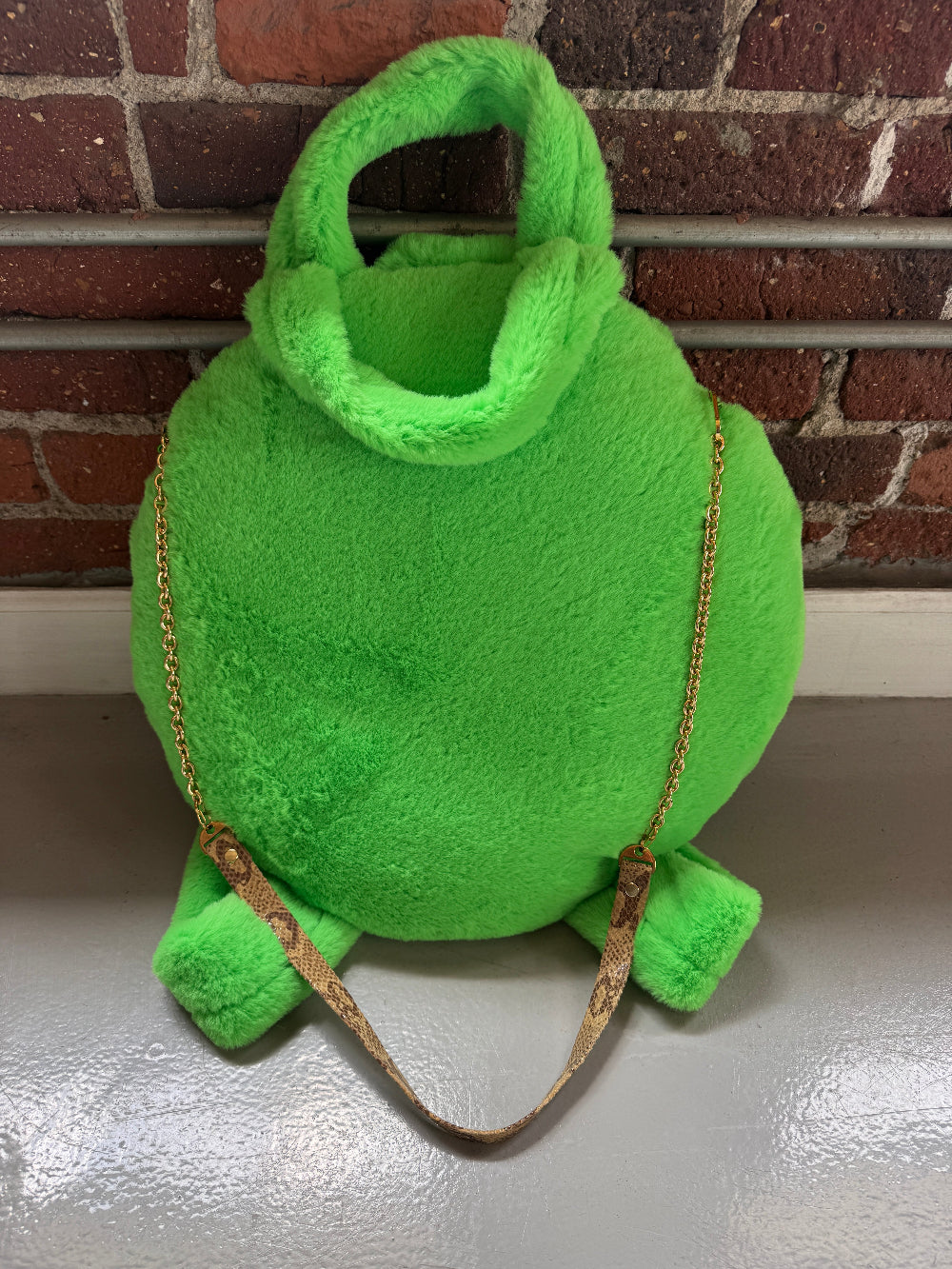 The-BARK-BED-PRO backpack-by-muse et moi-Cafe-Dog-bed-Computer-backpack-in green fluffy and round.